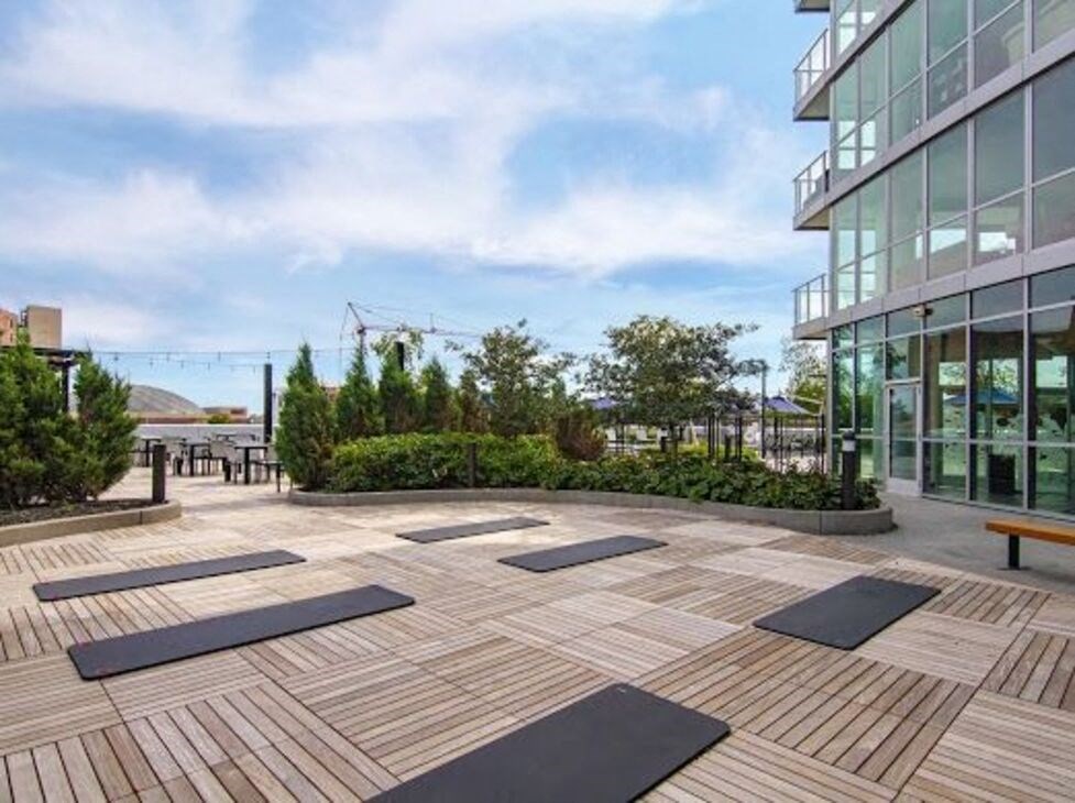 an image of a yoga deck in front of a building