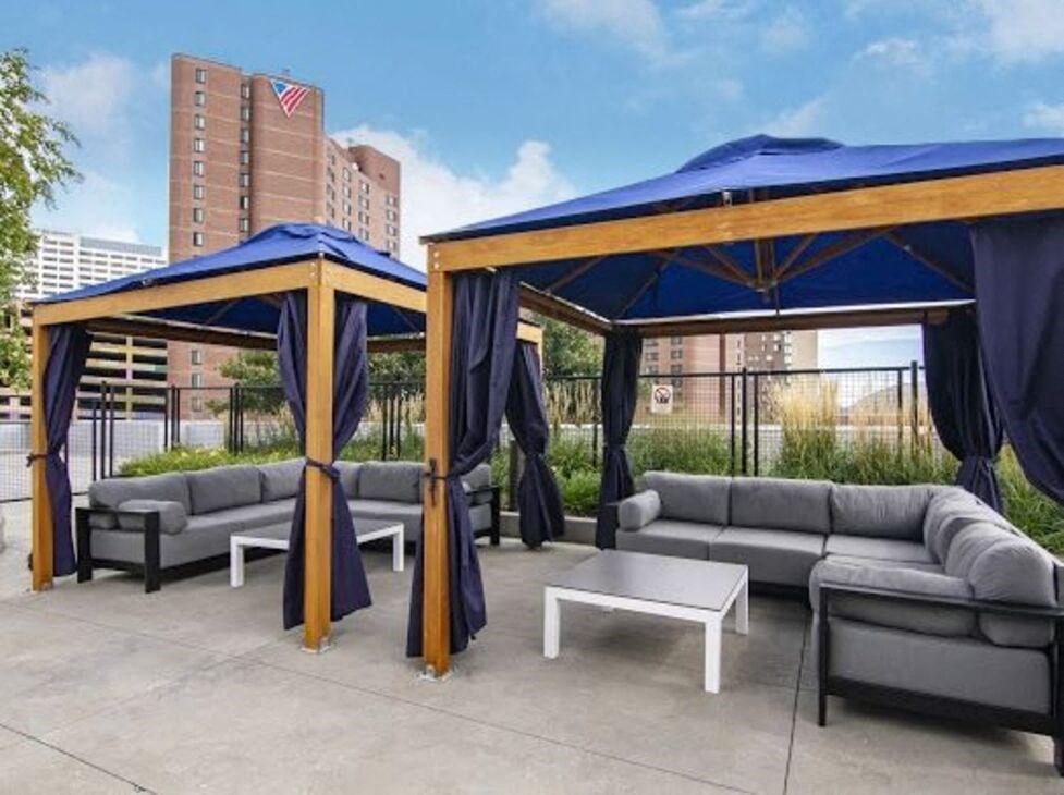 a patio with couches and a coffee table