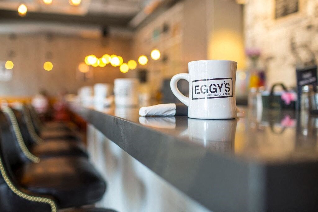 a cup of coffee sitting on a counter