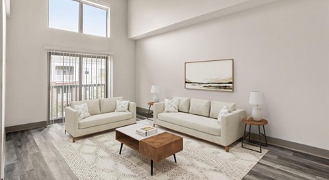 A living room with two couches, a coffee table, and a painting on the wall.