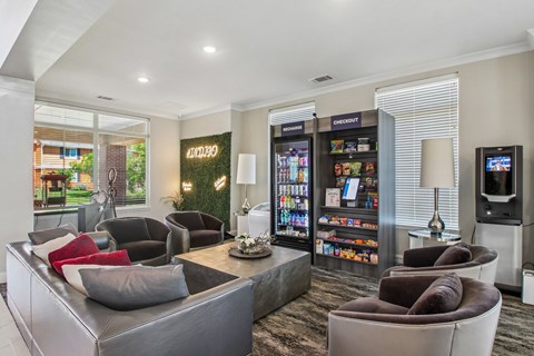 A modern living room with a grey couch and a coffee table.
