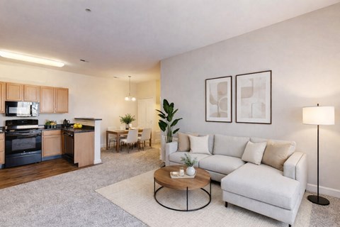 A modern living room with a white couch and a coffee table.
