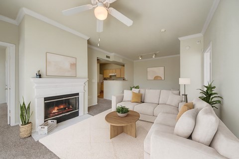 A living room with a fireplace and a couch.