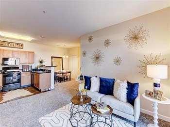 Residence at North Penn living room with hardwood kitchen flooring and lush carpet Residence at North Penn large living room with great lighting - Photo Gallery 4