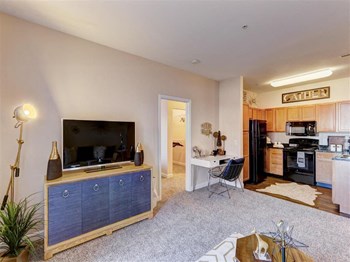 Residence at North Penn living room with office space Residence at North Penn living room with office space and natural lighting - Photo Gallery 5