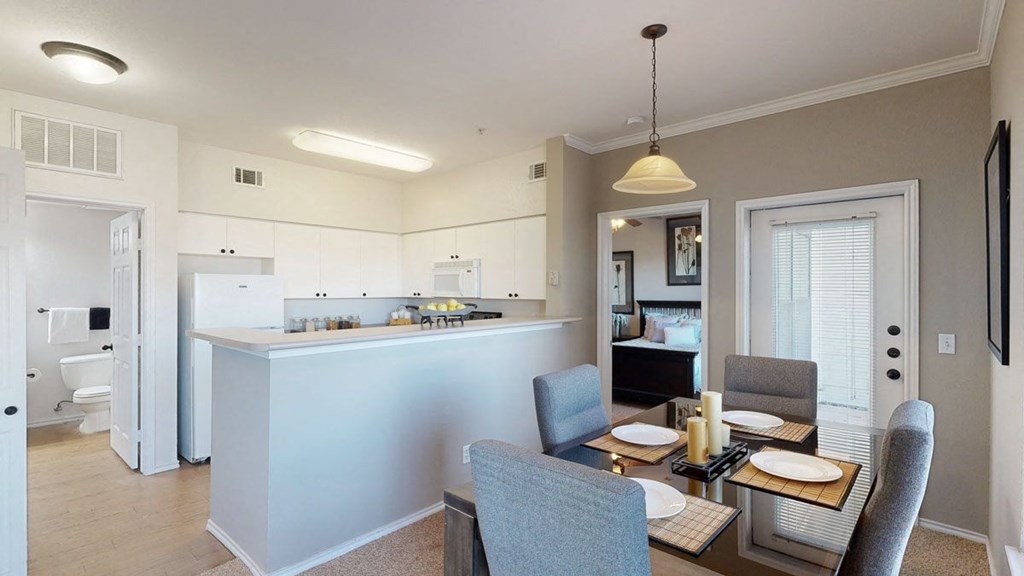 a kitchen and dining area in a 555 waverly unit