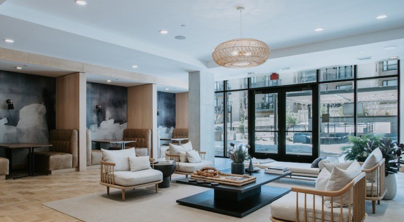 A modern living room with a large window overlooking a cityscape.
