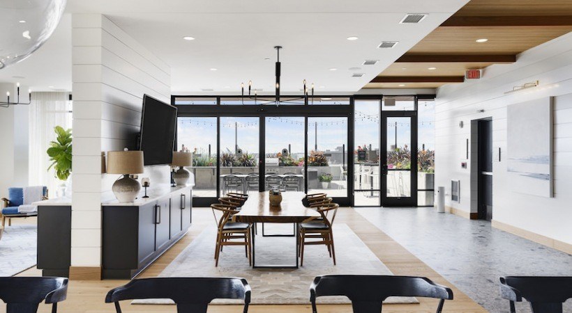 A modern living room with a large window and a view of the outdoors.
