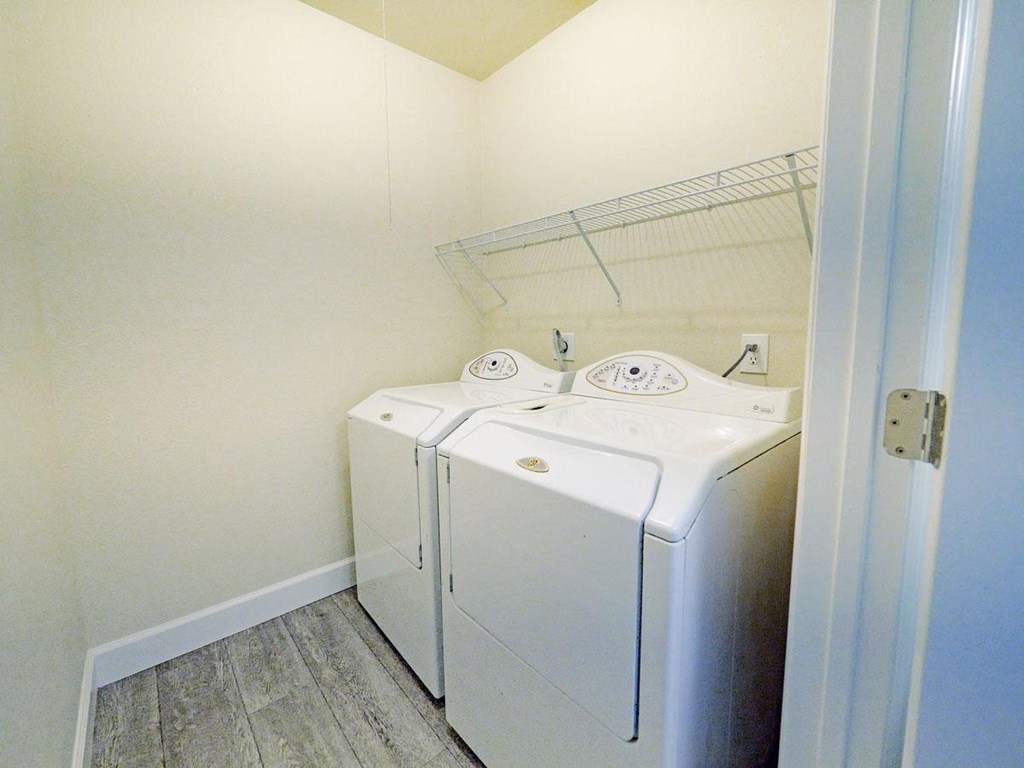 a washer and dryer in a small laundry room