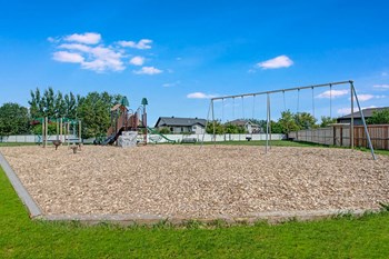 An outdoor playground for kids Sol Terrace Apartment Homes Exterior - Photo Gallery 5