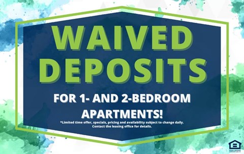 A sign advertising waived deposits for 1 and 2 bedroom apartments.