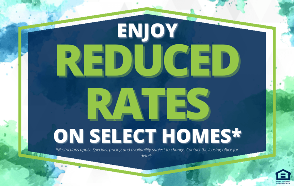 A sign advertising reduced rates on select homes.
