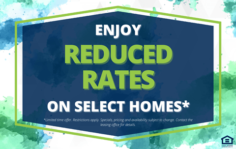 A sign advertising reduced rates on select homes.