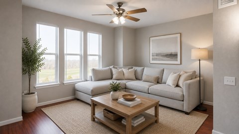 A living room with a white couch, a wooden coffee table, and a ceiling fan.