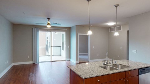 A kitchen with a sink and a counter top.