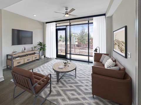 A living room with a brown chair and a brown couch.