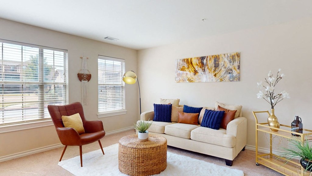 a living room with a couch and a chair