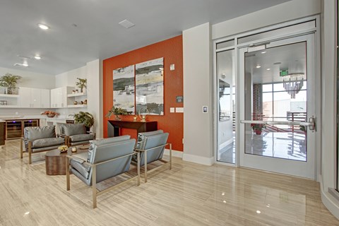 A modern living room with a grey sofa and a coffee table.