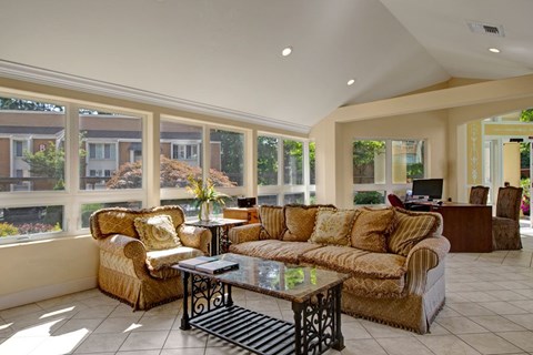 A living room with a large couch and a coffee table.
