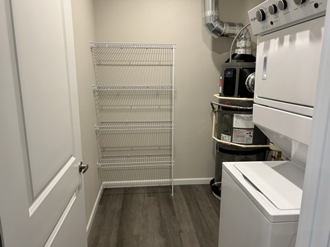 A small kitchen with a white oven and a white dishwasher.
