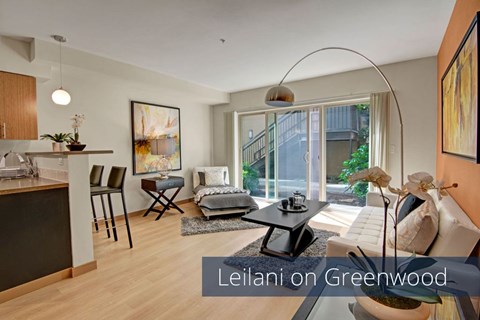 A living room with a dining table and chairs.