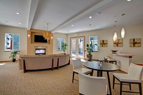 A living room with a large couch and a television.
