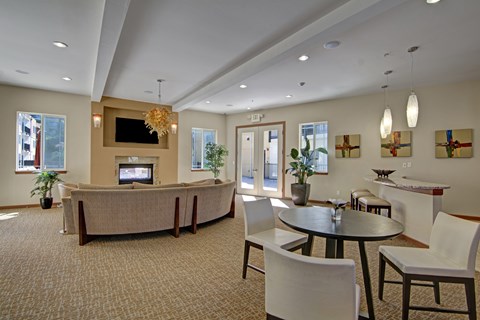A living room with a large couch and a television.