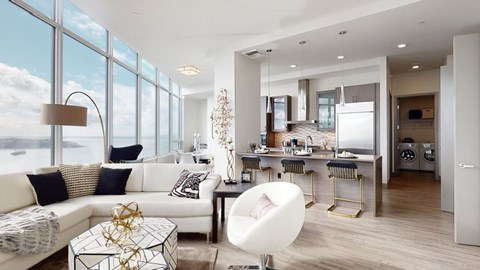 A modern living room with a white sofa and a glass table.