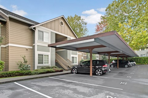 A carport with a car parked under it.