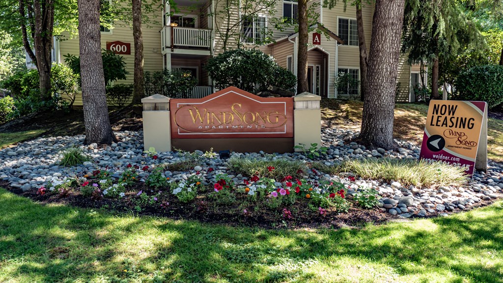 a sign in front of a building