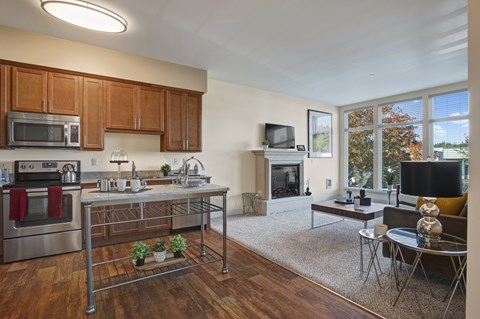A kitchen with a stove top oven and a microwave.