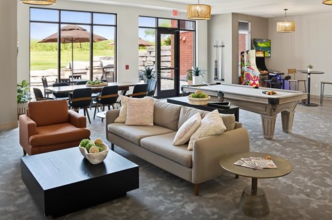 A living room with a couch, chair, and coffee table.