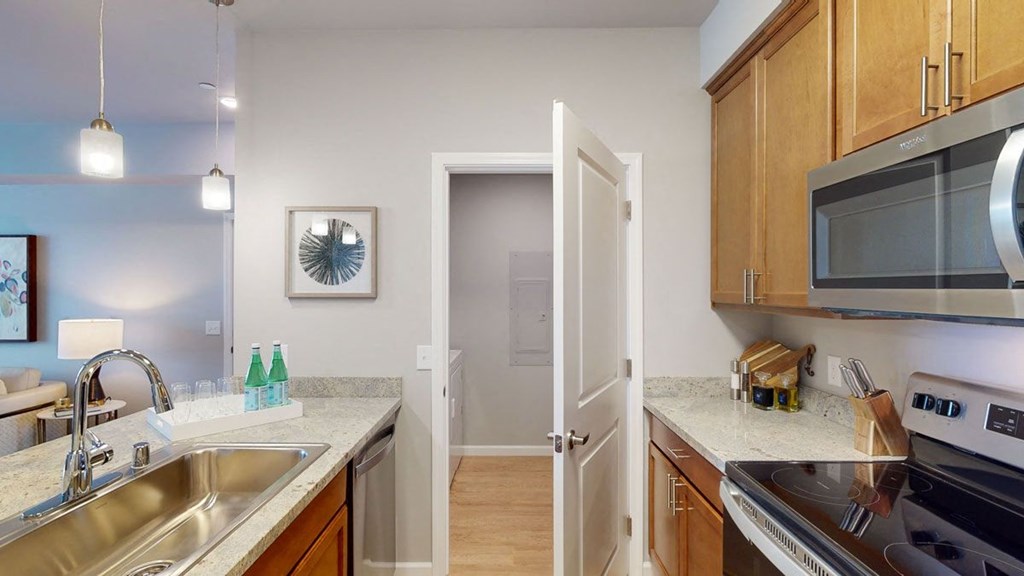 a kitchen with a sink and a microwave