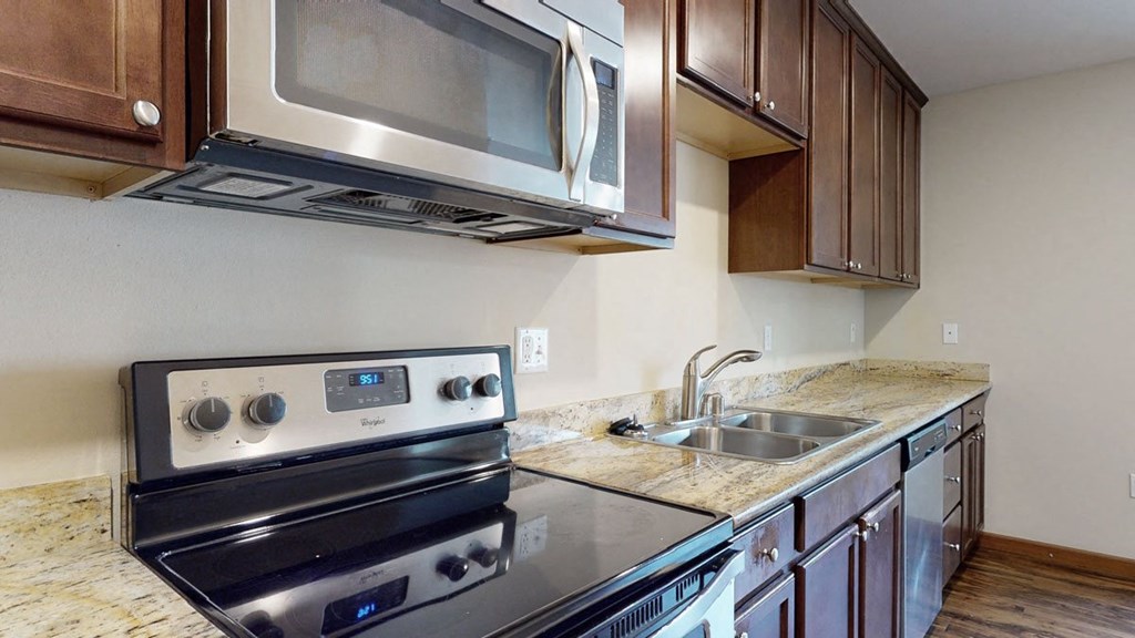 a kitchen with a stove and a sink