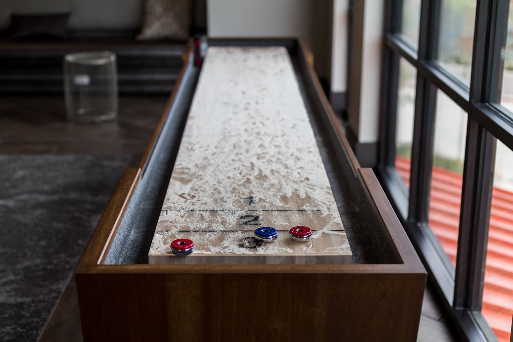 a ping pong table in the living room of a house