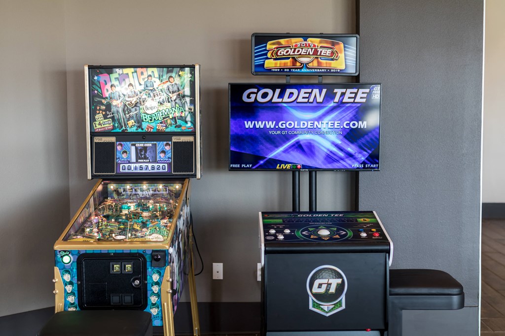 two video games and a large screen tv in a room