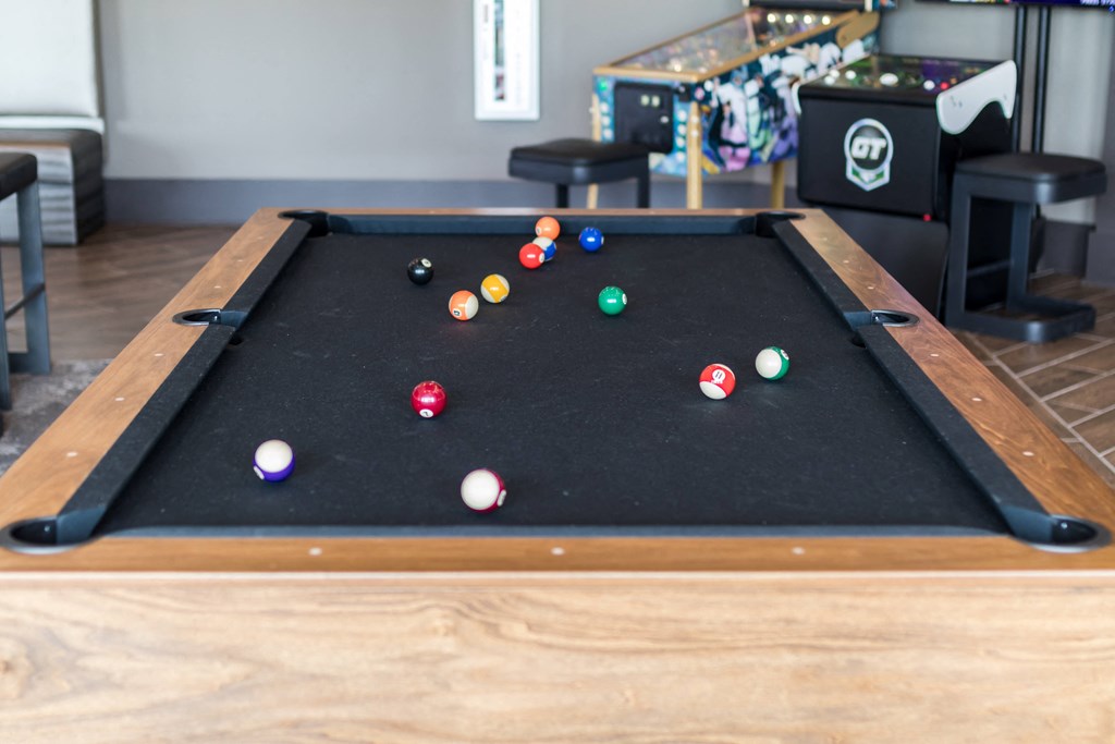 a pool table with a bunch of balls on it