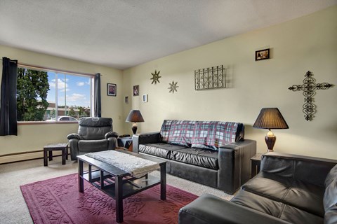 a living room with couches and a coffee table