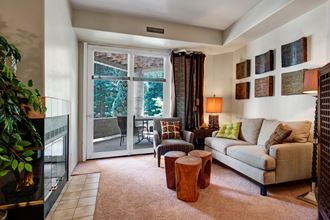 Cheyenne Creek Living Room With Balcony Cheyenne Creek Living Room Apartments in Colorado Springs, CO