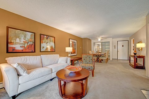 a living room with a couch and a table