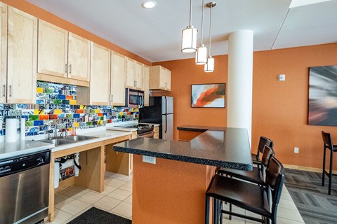 a kitchen with a counter top and a sink