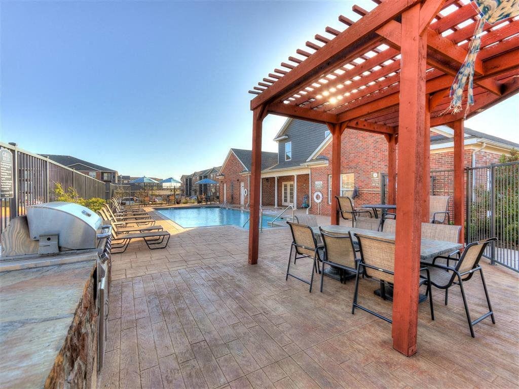 Residence at North Penn outdoor entertainment space with pool and grill