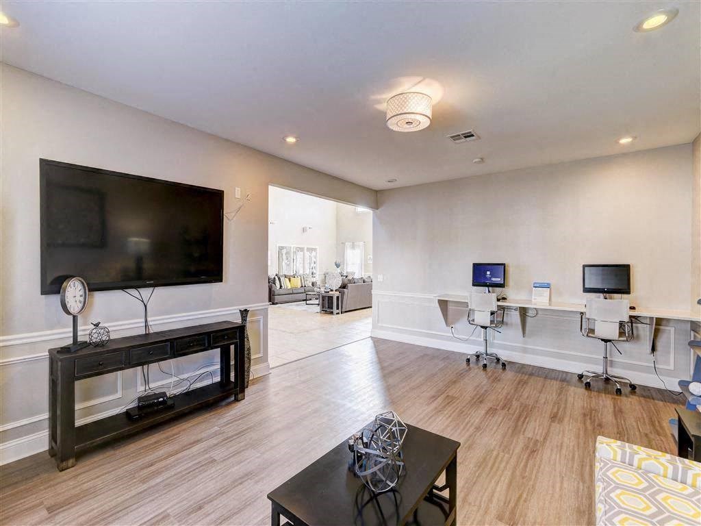 Residence at North Penn entertainment room with computers and television