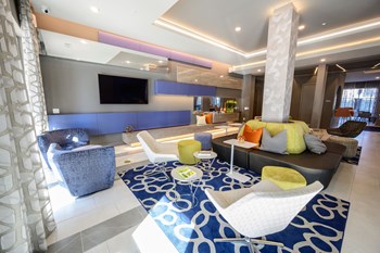 Harmony Luxury Apartments entertainment space with natural lighting - Photo Gallery 15