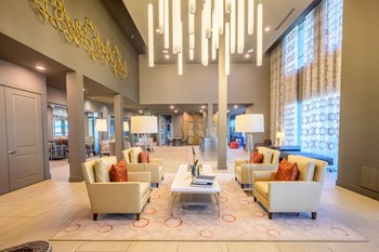 Harmony Luxury Apartments lounging space with great natural lighting Apartment near Dallas Fort Worth - Photo Gallery 17