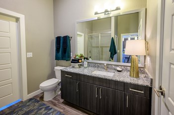 Harmony Luxury Apartments large bathroom with wooden floors - Photo Gallery 9