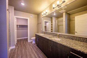 Harmony Luxury Apartments large bathroom with wooden floors - Photo Gallery 13
