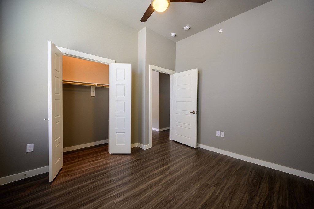 Harmony Luxury Apartments bedroom with tall ceilings and natural lighting