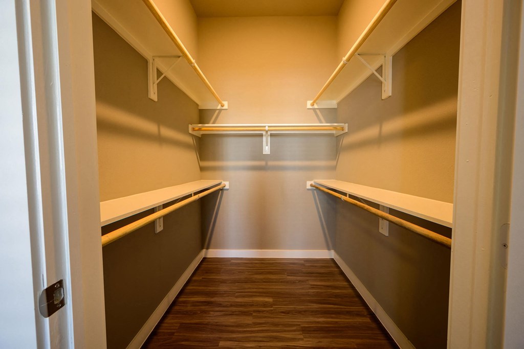 Harmony Luxury Apartments walk in closet with tall ceilings