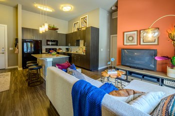 Harmony Luxury Apartments entertainment room with hardwood floors - Photo Gallery 5